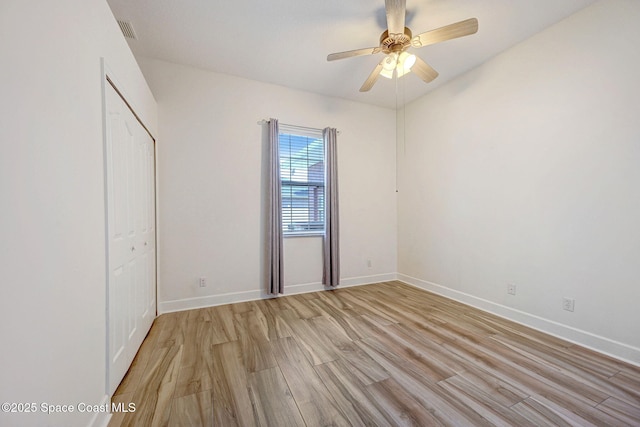 2604 Canary Isles Dr, Melbourne, FL 32901 - unfurnished bedroom featuring light wood finished floors, a closet, and ceiling fan