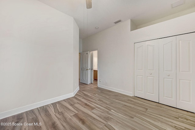 2604 Canary Isles Dr, Melbourne, FL 32901 - unfurnished bedroom with light wood-style flooring, a closet, and ceiling fan