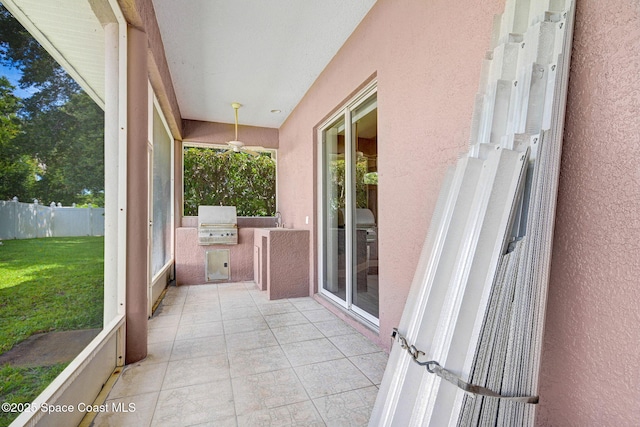 2604 Canary Isles Dr, Melbourne, FL 32901 - unfurnished sunroom featuring exterior kitchen and ceiling fan