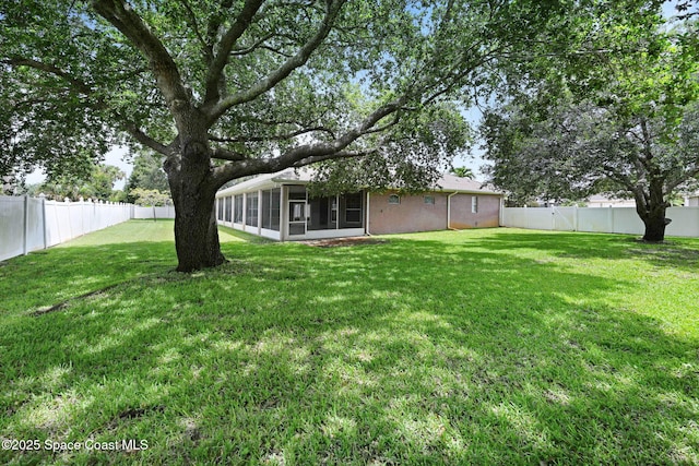 2604 Canary Isles Dr, Melbourne, FL 32901 - fenced backyard with a sunroom