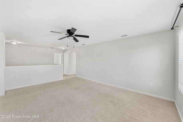 4318 Alligator Flag Cir, West Melbourne, FL 32904 - empty room with light colored carpet, a ceiling fan, and arched walkways
