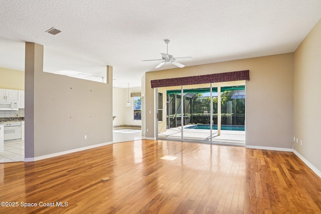 1526 Cypress Trace Dr, Melbourne, FL 32940 - spare room featuring light wood finished floors, ceiling fan, and a textured ceiling