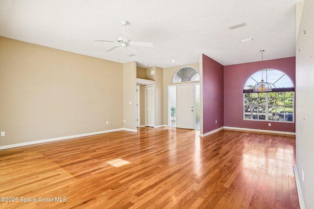 1526 Cypress Trace Dr, Melbourne, FL 32940 - unfurnished living room with light wood-type flooring, a ceiling fan, and a chandelier