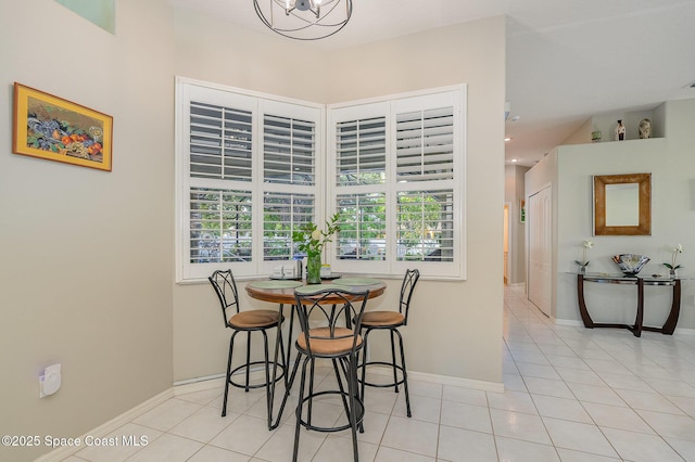 356 Fuller St SE, Palm Bay, FL 32909 - dining area featuring light tile patterned floors and a chandelier