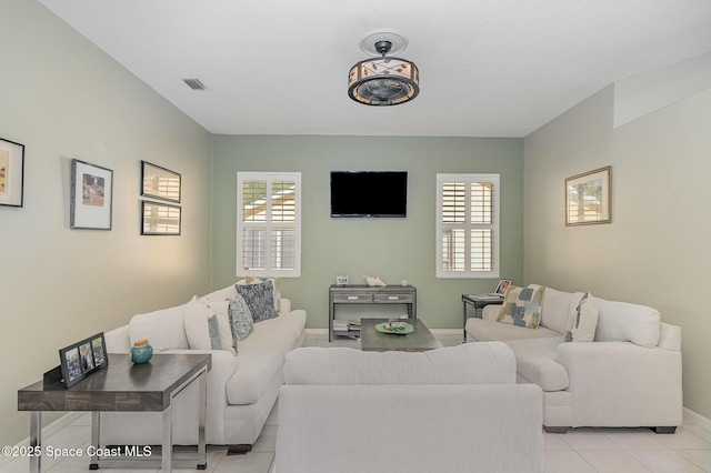 356 Fuller St SE, Palm Bay, FL 32909 - living area featuring light tile patterned flooring and baseboards