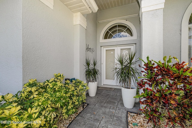 356 Fuller St SE, Palm Bay, FL 32909 - doorway to property with stucco siding