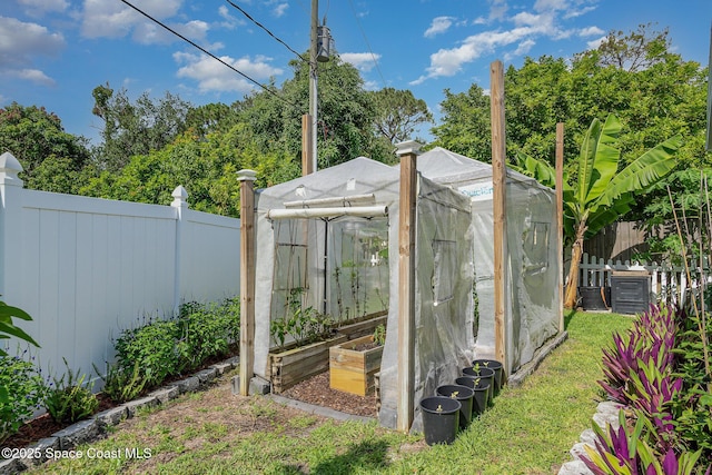 356 Fuller St SE, Palm Bay, FL 32909 - view of greenhouse with a fenced backyard and a garden