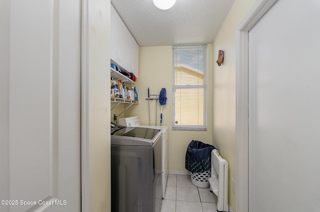 356 Fuller St SE, Palm Bay, FL 32909 - laundry room featuring light tile patterned floors, washer and clothes dryer, and a textured ceiling