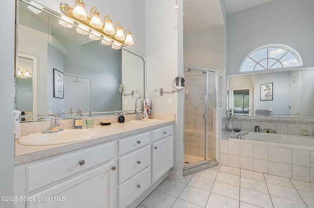 356 Fuller St SE, Palm Bay, FL 32909 - full bathroom featuring tile patterned flooring, double vanity, a shower stall, and a garden tub