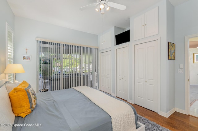 356 Fuller St SE, Palm Bay, FL 32909 - bedroom with wood finished floors, two closets, and ceiling fan