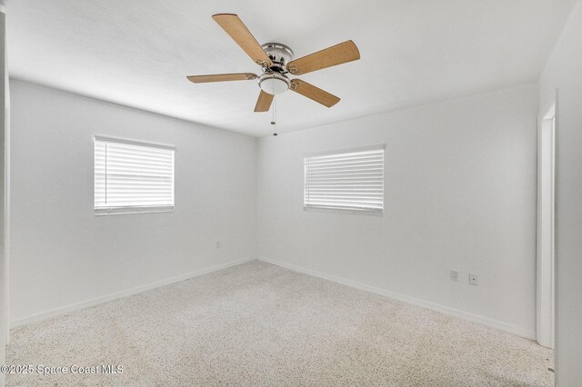 1575 Glen Haven Dr, Merritt Island, FL 32952 - unfurnished room with baseboards and a ceiling fan