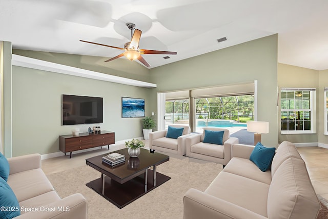9495 Fleming Grant Rd, Sebastian, FL 32976 - living area with vaulted ceiling and ceiling fan