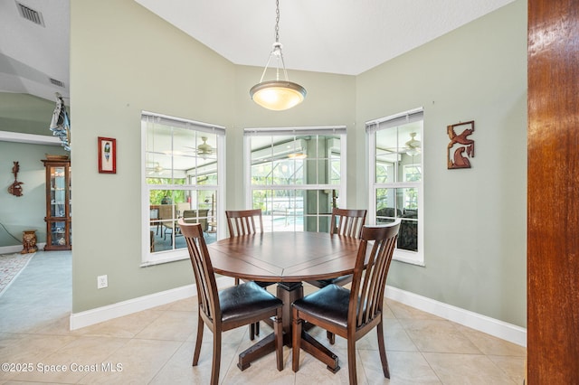 9495 Fleming Grant Rd, Sebastian, FL 32976 - dining room with lofted ceiling, a ceiling fan, and light tile patterned floors