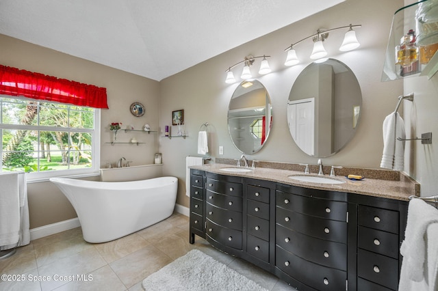 9495 Fleming Grant Rd, Sebastian, FL 32976 - bathroom with double vanity, a freestanding tub, and tile patterned flooring