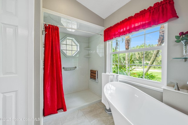 9495 Fleming Grant Rd, Sebastian, FL 32976 - full bath with curtained shower, vaulted ceiling, a soaking tub, and tile patterned floors