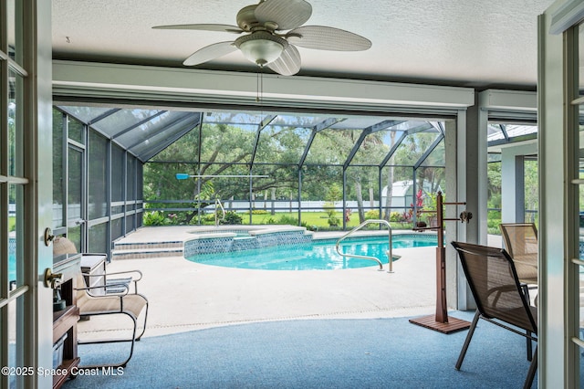 9495 Fleming Grant Rd, Sebastian, FL 32976 - view of pool featuring a patio, a ceiling fan, a pool with connected hot tub, and glass enclosure