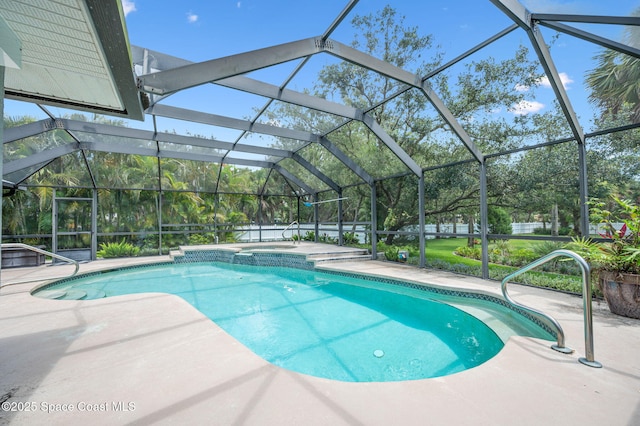9495 Fleming Grant Rd, Sebastian, FL 32976 - view of swimming pool with a patio area, a pool with connected hot tub, and a lanai