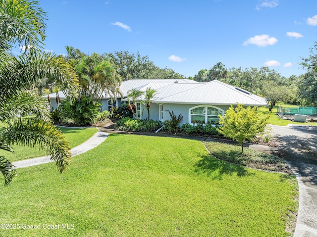 9495 Fleming Grant Rd, Sebastian, FL 32976 - ranch-style home featuring stucco siding and a front yard
