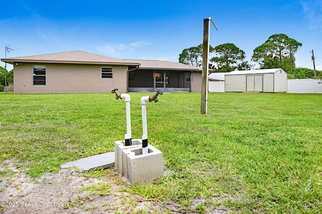 407 Heather Ave NE, Palm Bay, FL 32907 - view of yard with a sunroom and a storage unit