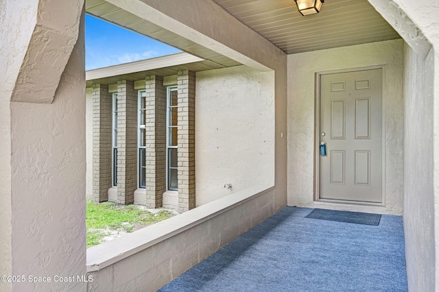407 Heather Ave NE, Palm Bay, FL 32907 - view of exterior entry featuring stucco siding