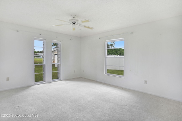 407 Heather Ave NE, Palm Bay, FL 32907 - carpeted empty room featuring a ceiling fan and baseboards
