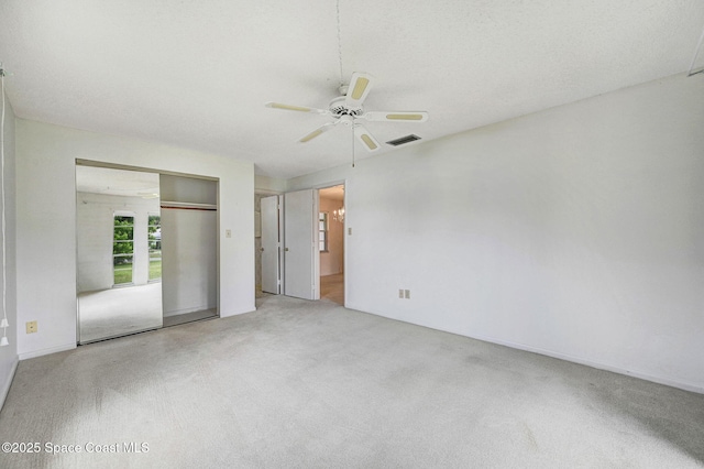 407 Heather Ave NE, Palm Bay, FL 32907 - unfurnished bedroom with carpet floors, a closet, and a ceiling fan