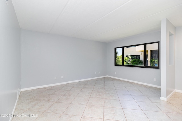 1145 N Shannon Ave Unit 29, Indialantic, FL 32903 - spare room featuring light tile patterned floors and baseboards