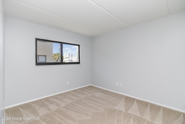 1145 N Shannon Ave Unit 29, Indialantic, FL 32903 - carpeted empty room featuring baseboards