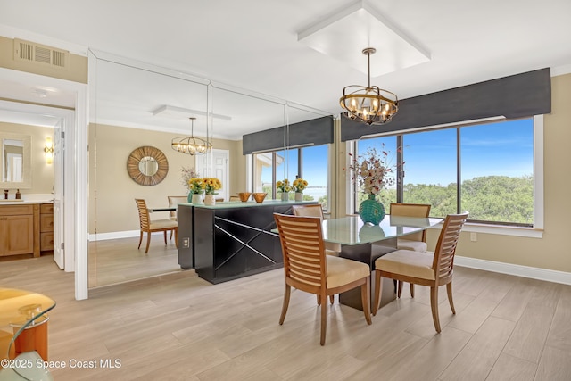 2220 Front St Unit 401, Melbourne, FL 32901 - dining space with a chandelier and light wood-style floors