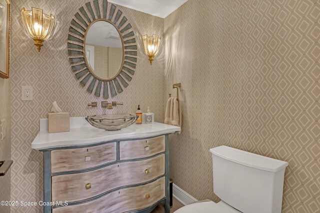 2220 Front St Unit 401, Melbourne, FL 32901 - bathroom featuring wallpapered walls and vanity