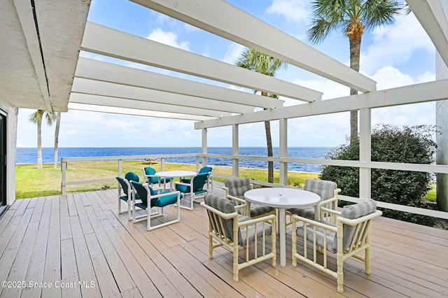 2467 S Washington Ave Unit 103B, Titusville, FL 32780 - wooden deck featuring a water view, a pergola, and outdoor dining area