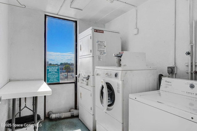 2467 S Washington Ave Unit 103B, Titusville, FL 32780 - communal laundry room with washing machine and clothes dryer