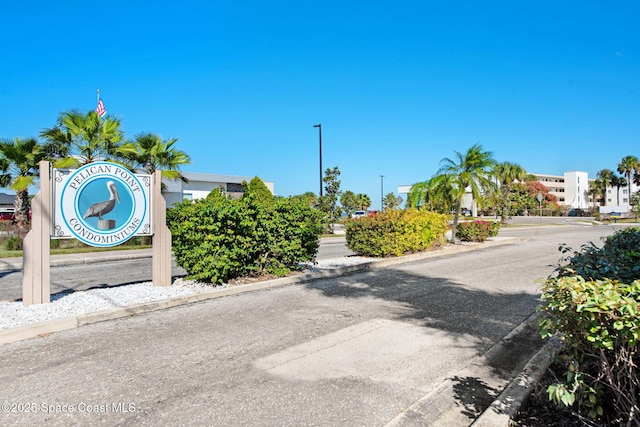 2467 S Washington Ave Unit 103B, Titusville, FL 32780 - view of asphalt road with curbs and street lights