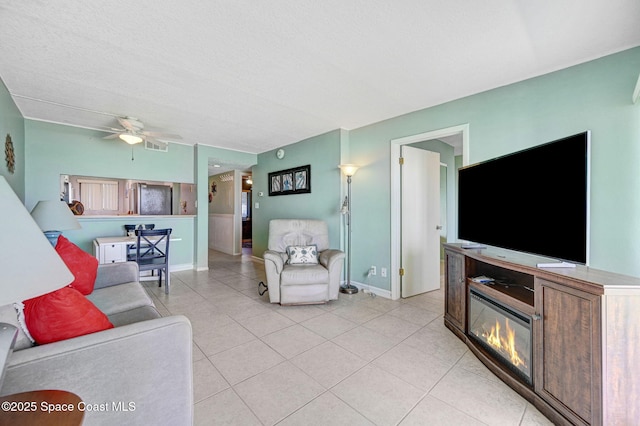 2467 S Washington Ave Unit 103B, Titusville, FL 32780 - living area featuring light tile patterned floors and a ceiling fan