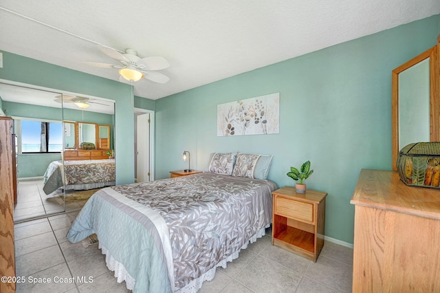 2467 S Washington Ave Unit 103B, Titusville, FL 32780 - tiled bedroom with a closet and ceiling fan