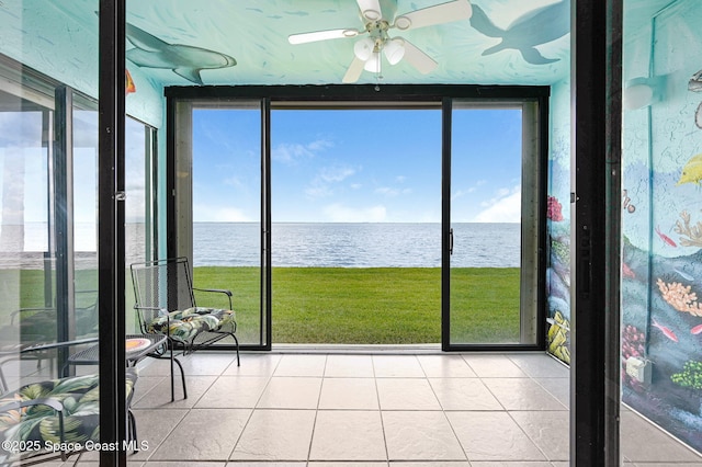 2467 S Washington Ave Unit 103B, Titusville, FL 32780 - unfurnished sunroom featuring a water view, tile patterned floors, and healthy amount of natural light