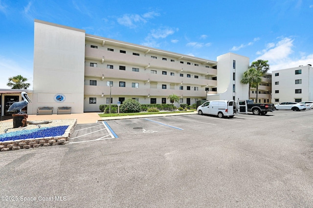 2467 S Washington Ave Unit 103B, Titusville, FL 32780 - view of apartment building / complex with uncovered parking