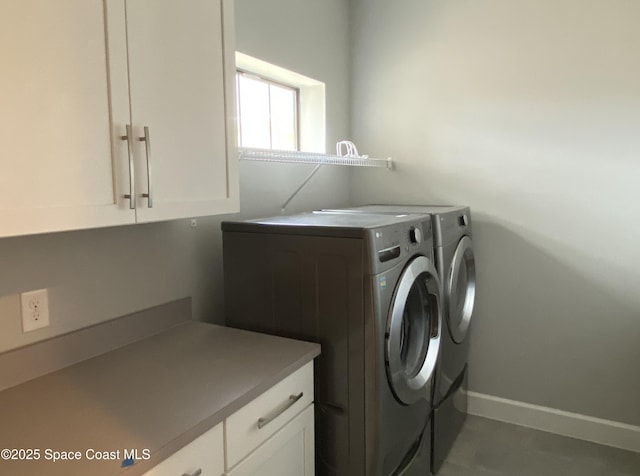 6684 Vista Hermosa Dr, Melbourne, FL 32940 - laundry room featuring washing machine and dryer and cabinet space