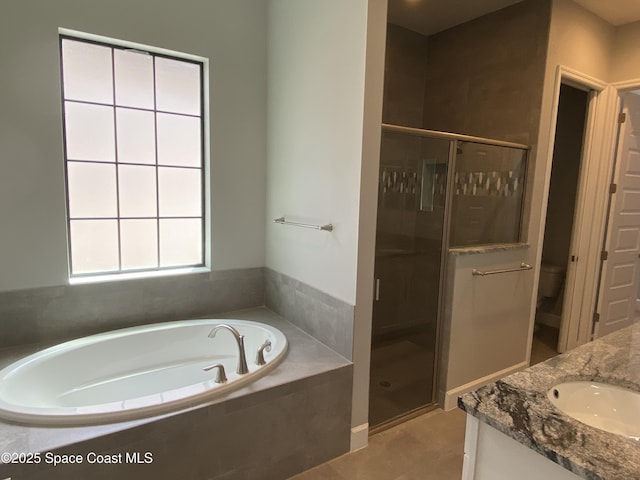 6684 Vista Hermosa Dr, Melbourne, FL 32940 - bathroom featuring a garden tub, a shower stall, and vanity
