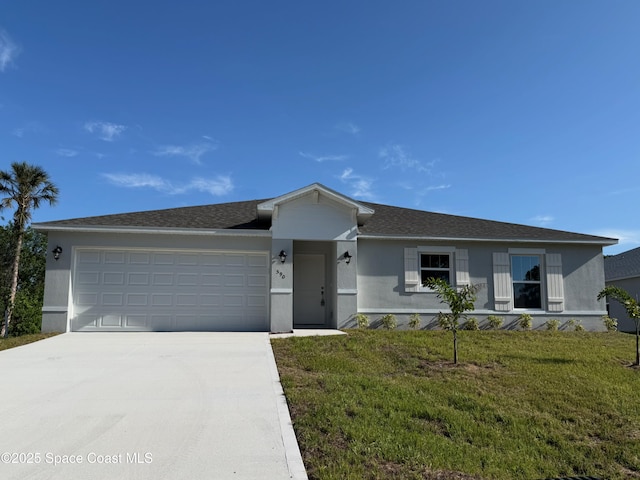 590 Cardinal St SE Unit 10, Palm Bay, FL 32909 - single story home with stucco siding, driveway, a garage, a front yard, and a shingled roof