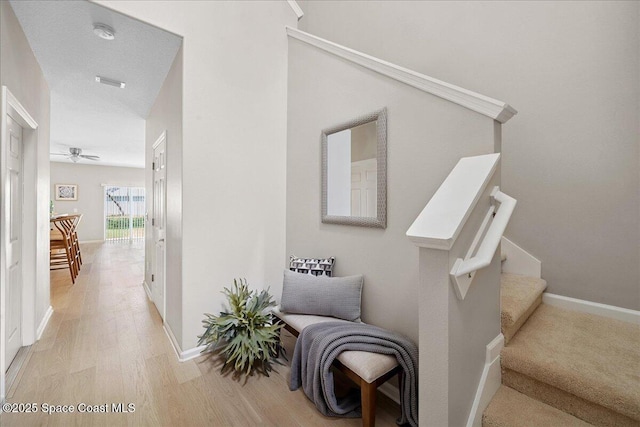 2605 Revolution St Unit 104, Melbourne, FL 32935 - stairway featuring wood finished floors and ceiling fan