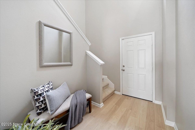 2605 Revolution St Unit 104, Melbourne, FL 32935 - entryway with stairway and light wood-style flooring