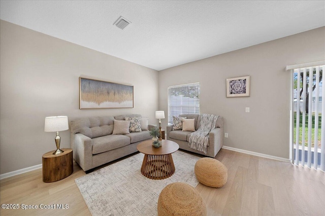 2605 Revolution St Unit 104, Melbourne, FL 32935 - living room with wood finished floors and baseboards