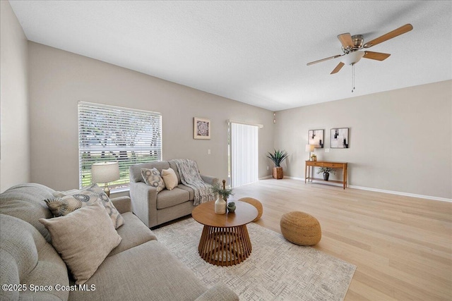 2605 Revolution St Unit 104, Melbourne, FL 32935 - living area featuring wood finished floors and a ceiling fan
