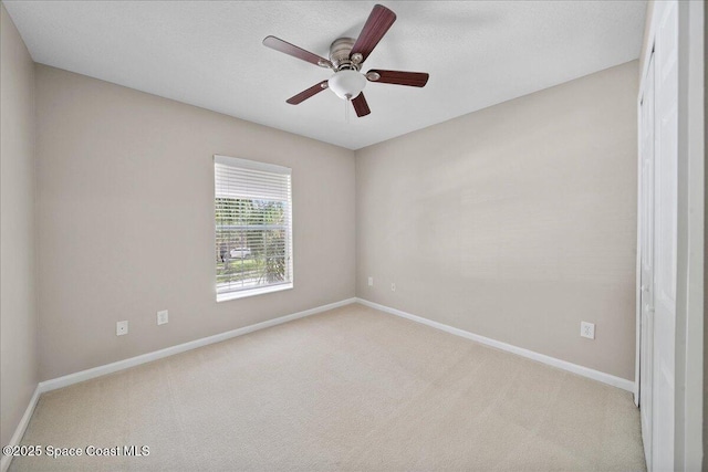2605 Revolution St Unit 104, Melbourne, FL 32935 - carpeted empty room featuring baseboards and ceiling fan