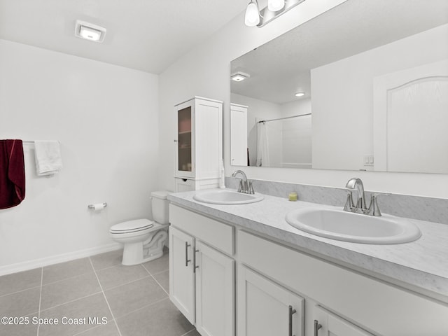 2926 Tishman Rd SE, Palm Bay, FL 32909 - bathroom with tile patterned flooring, double vanity, and a shower