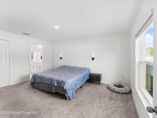 2926 Tishman Rd SE, Palm Bay, FL 32909 - carpeted bedroom with baseboards and ensuite bathroom