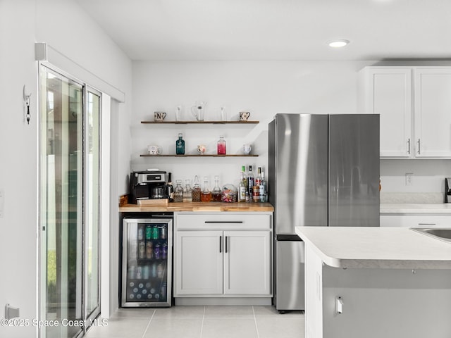 2926 Tishman Rd SE, Palm Bay, FL 32909 - indoor bar featuring beverage cooler, freestanding refrigerator, light tile patterned flooring, and recessed lighting
