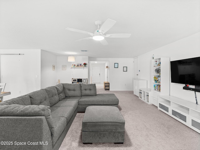 2926 Tishman Rd SE, Palm Bay, FL 32909 - living room featuring ceiling fan, light carpet, and bar