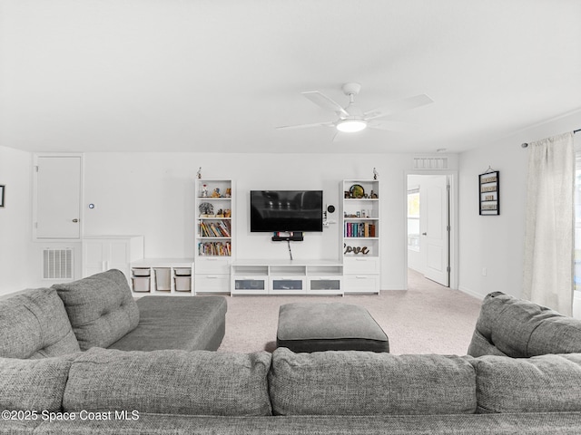 2926 Tishman Rd SE, Palm Bay, FL 32909 - carpeted living area with ceiling fan and baseboards